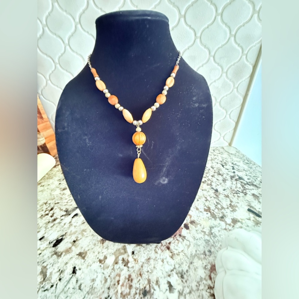 Artisan Polished wooded beaded necklace accented with beads.